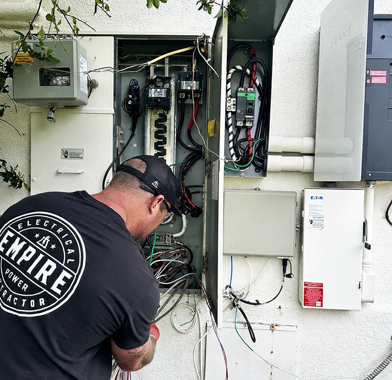 Employee working on an electrical panel